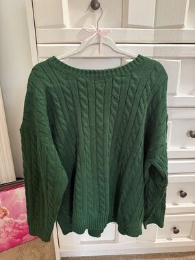 Grey Bandit green sweater